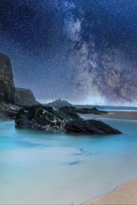 Preview wallpaper coast, sea, rocks, milky way, sand, night