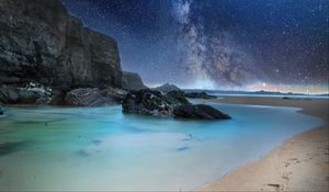 Preview wallpaper coast, sea, rocks, milky way, sand, night