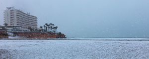 Preview wallpaper coast, sea, snow, palm trees, building, winter