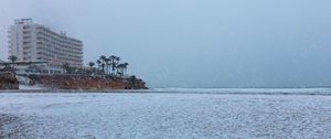 Preview wallpaper coast, sea, snow, palm trees, building, winter