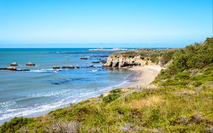 Preview wallpaper coast, sea, stones, grass, landscape