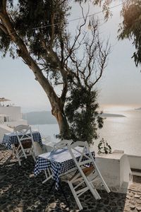 Preview wallpaper coast, sea, table, chairs, aesthetics