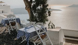 Preview wallpaper coast, sea, table, chairs, aesthetics