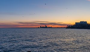 Preview wallpaper coast, sea, water, buildings, horizon, twilight