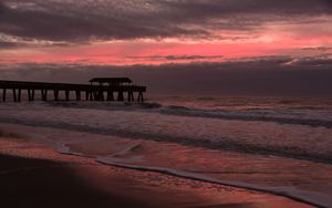 Preview wallpaper coast, sea, waves, pier, twilight, nature