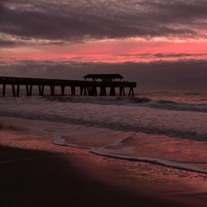 Preview wallpaper coast, sea, waves, pier, twilight, nature