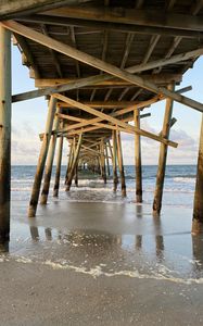 Preview wallpaper coast, sea, waves, logs, pier