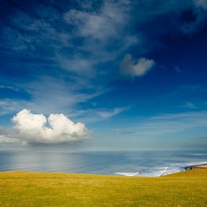 Preview wallpaper coast, sky, cloud, ocean, meadow, glade, land, blue, green