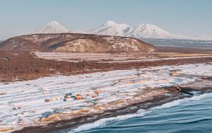 Preview wallpaper coast, snowy, aerial  view, water, mountains, landscape