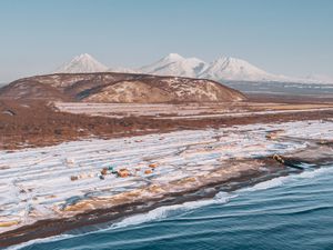 Preview wallpaper coast, snowy, aerial  view, water, mountains, landscape