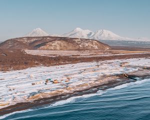 Preview wallpaper coast, snowy, aerial  view, water, mountains, landscape