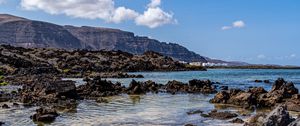 Preview wallpaper coast, stones, mountains, sea, landscape, nature