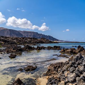 Preview wallpaper coast, stones, mountains, sea, landscape, nature