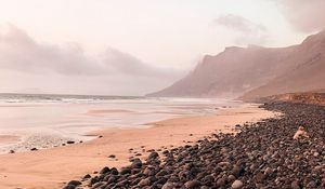 Preview wallpaper coast, stones, pebbles, rocks, sea