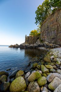 Preview wallpaper coast, stones, pebbles, rock, sea