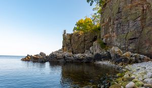 Preview wallpaper coast, stones, pebbles, rock, sea