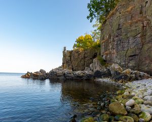 Preview wallpaper coast, stones, pebbles, rock, sea