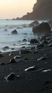 Preview wallpaper coast, stones, rock, sea, landscape, twilight