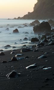 Preview wallpaper coast, stones, rock, sea, landscape, twilight