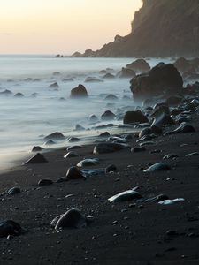 Preview wallpaper coast, stones, rock, sea, landscape, twilight