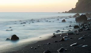 Preview wallpaper coast, stones, rock, sea, landscape, twilight