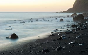 Preview wallpaper coast, stones, rock, sea, landscape, twilight