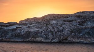 Preview wallpaper coast, stones, rocks, sunset, water