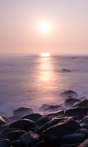 Preview wallpaper coast, stones, rocks, sun, water, fog, landscape