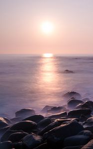 Preview wallpaper coast, stones, rocks, sun, water, fog, landscape