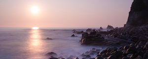 Preview wallpaper coast, stones, rocks, sun, water, fog, landscape