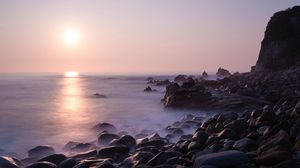 Preview wallpaper coast, stones, rocks, sun, water, fog, landscape