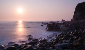 Preview wallpaper coast, stones, rocks, sun, water, fog, landscape