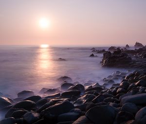 Preview wallpaper coast, stones, rocks, sun, water, fog, landscape