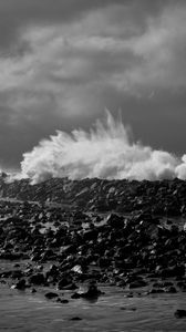 Preview wallpaper coast, stones, sea, splashes, waves, black and white, storm