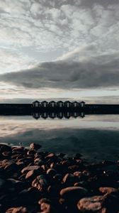 Preview wallpaper coast, stones, sea, houses, reflection