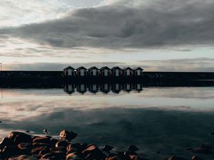 Preview wallpaper coast, stones, sea, houses, reflection