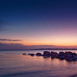 Preview wallpaper coast, stones, sea, water, twilight, landscape