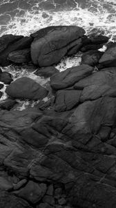 Preview wallpaper coast, stones, sea, waves, black and white, aerial view