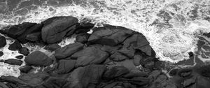 Preview wallpaper coast, stones, sea, waves, black and white, aerial view