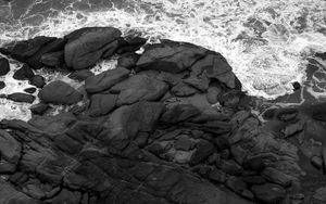 Preview wallpaper coast, stones, sea, waves, black and white, aerial view