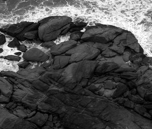 Preview wallpaper coast, stones, sea, waves, black and white, aerial view