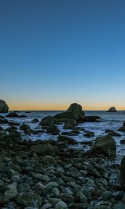 Preview wallpaper coast, stones, sea, water, landscape, twilight