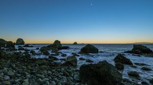 Preview wallpaper coast, stones, sea, water, landscape, twilight