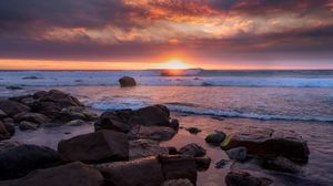 Preview wallpaper coast, stones, sea, sun, sunset
