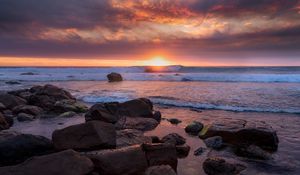 Preview wallpaper coast, stones, sea, sun, sunset