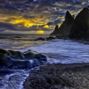 Preview wallpaper coast, stones, water, streams, sea, evening, decline, colors, twilight