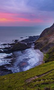 Preview wallpaper coast, sunset, rocks, surf