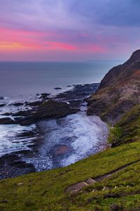 Preview wallpaper coast, sunset, rocks, surf