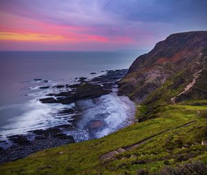 Preview wallpaper coast, sunset, rocks, surf