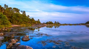 Preview wallpaper coast, trees, stones, lake, sky